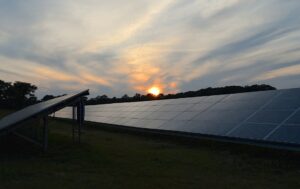 Solar panels on a vibrant sunset, highlighting the beauty and efficiency of a sustainable solar system for clean energy generation.